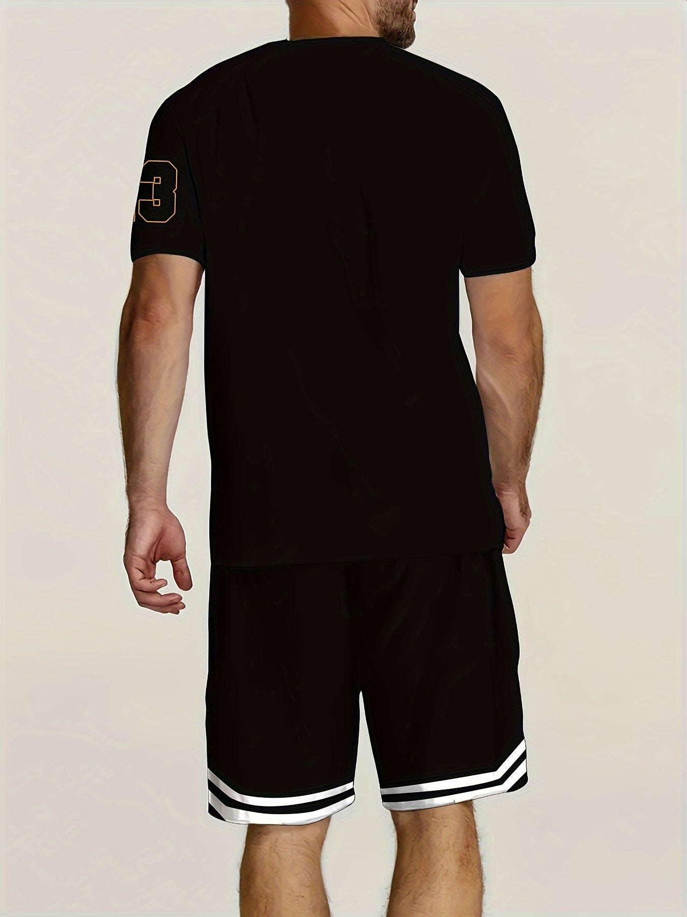 Men's summer fashion two-piece set featuring jersey number 23 print short-sleeve shirt and black sports shorts with pockets and drawstring. Comfortable, easy to care for fabric that is