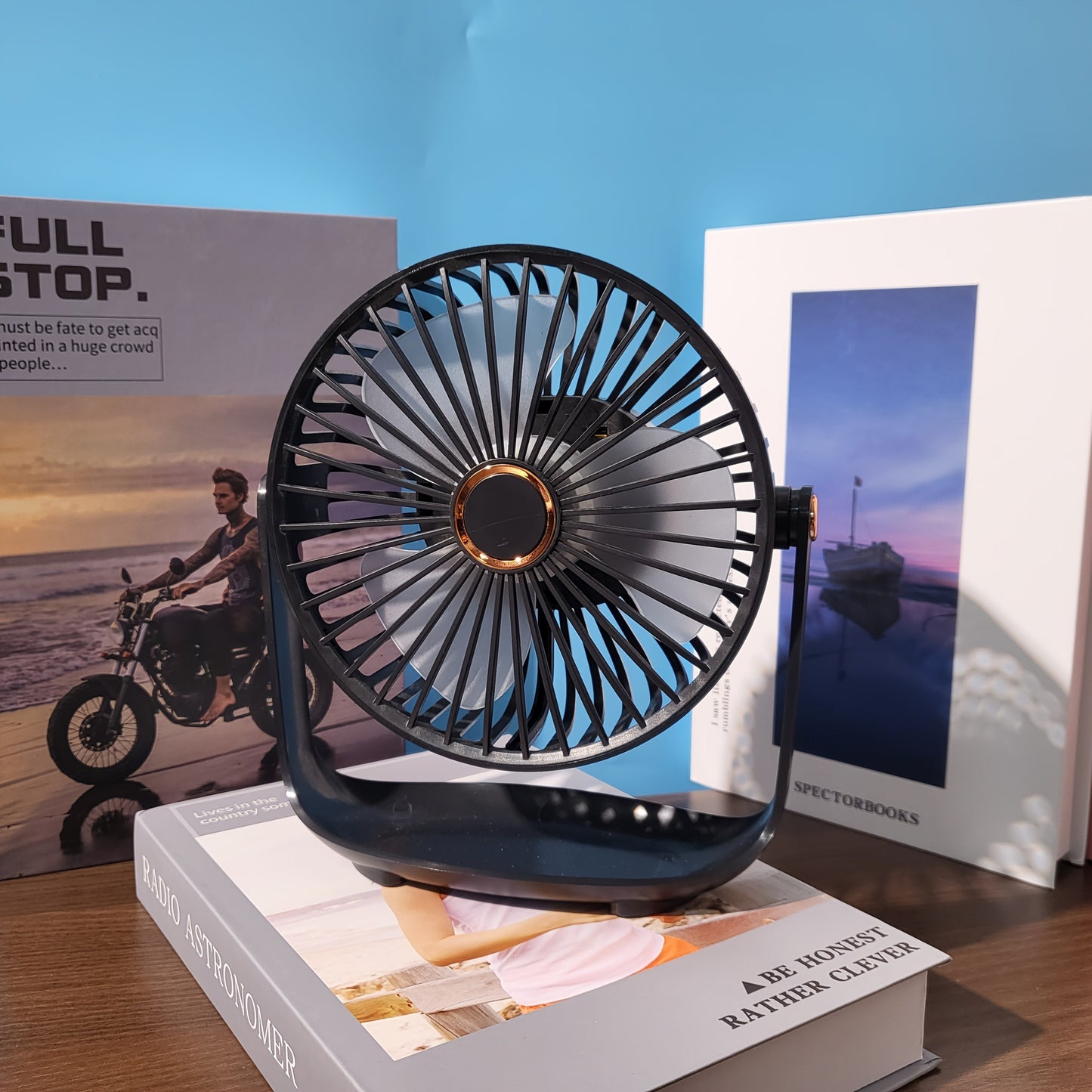 Experience the convenience of the JKUOO 19.99cm Portable Desk Fan with Nightlight. This fan features USB-C charging, 5-speed settings, 360° tilt, quiet operation, a 1200mAh lithium battery, and is made of high-quality plastic material. Perfect for both