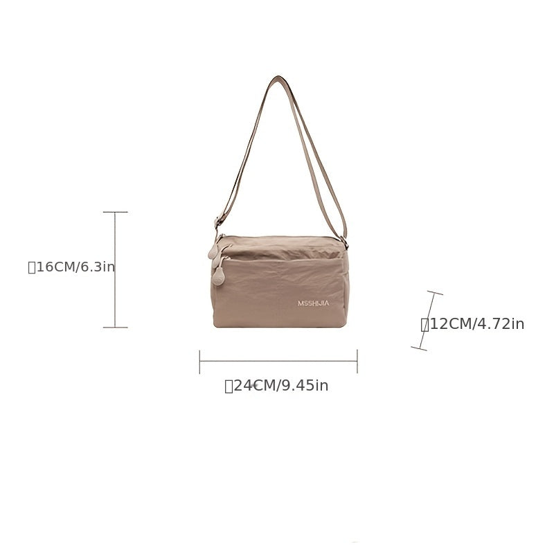 Stylish nylon crossbody bag for women: spacious, lightweight, versatile solid color with zip closure, ideal for everyday use. Available in khaki/black.