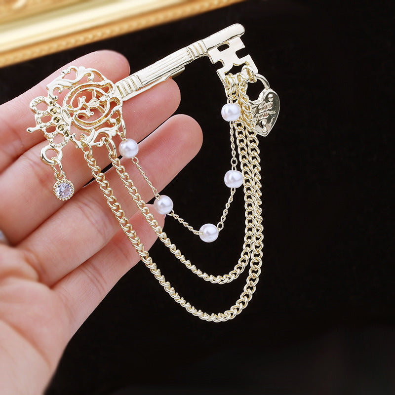 SKEDS Elegant Key-Shaped Brooch adorned with Rhinestones, Irregular Pearl, and Chain Tassel, a Stylish Korean Fashion Accessory for Both Women and Men