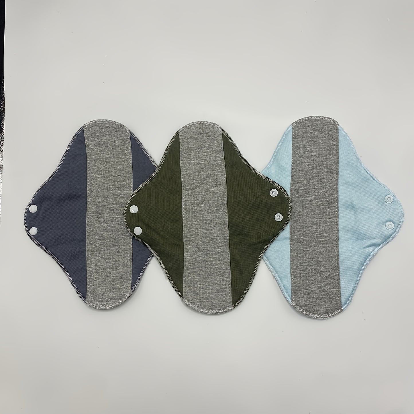 4-Pack reusable cotton menstrual pads for leak-proof protection, ideal for women and elderly with unscented knit fabric.