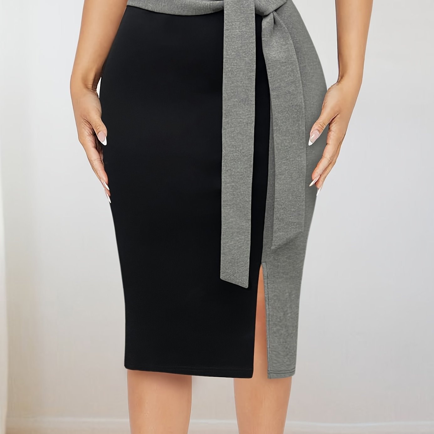 Stylish Color Block Tie-Waist Midi Skirt made of stretchy rayon blend with maroon & black design. Suitable for office or casual wear in spring/summer. Machine washable and comfortable fit.