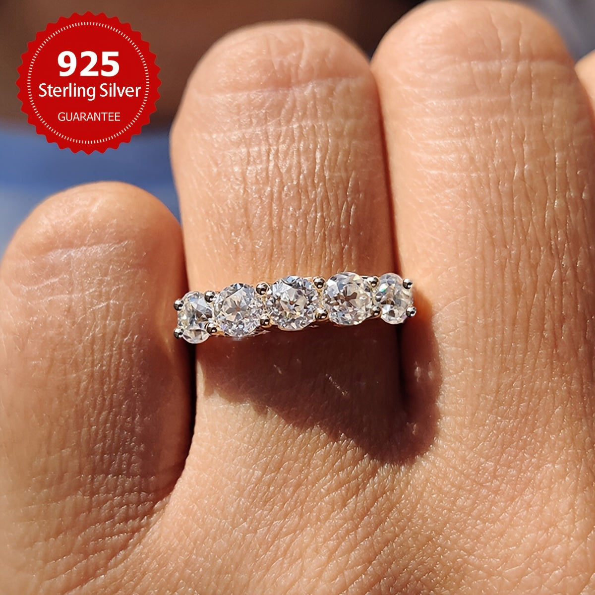 A stunning engagement ring with 7 pieces of 0.3 carat Moissanite set in S925 pure silver. This hypoallergenic ring is perfect as a promise ring or eternal ring, ideal for anniversaries and Valentine's Day. It makes a luxurious gift for women, with