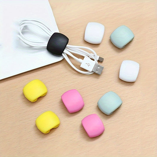 Durable plastic cable organizer clips for charging and earphone cords; tangle-free storage solution.