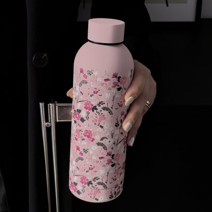 Stylish 16.9oz insulated water bottle with chic pink floral design, perfect for travel, sports, and everyday use. Great gift for birthdays and holidays.