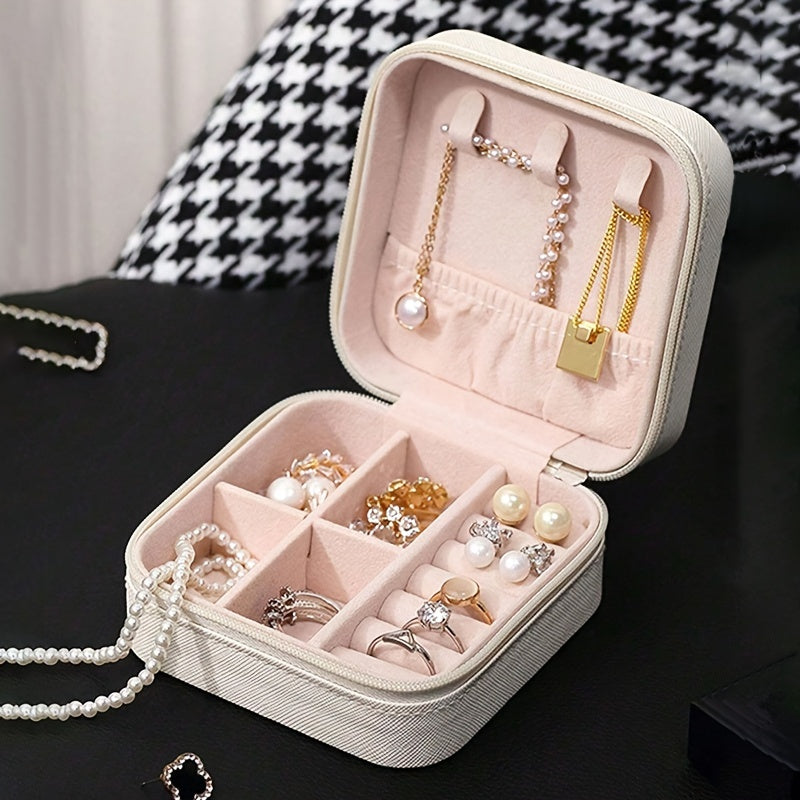 Portable jewelry storage box for rings, necklaces, and earrings. Ideal for travel.