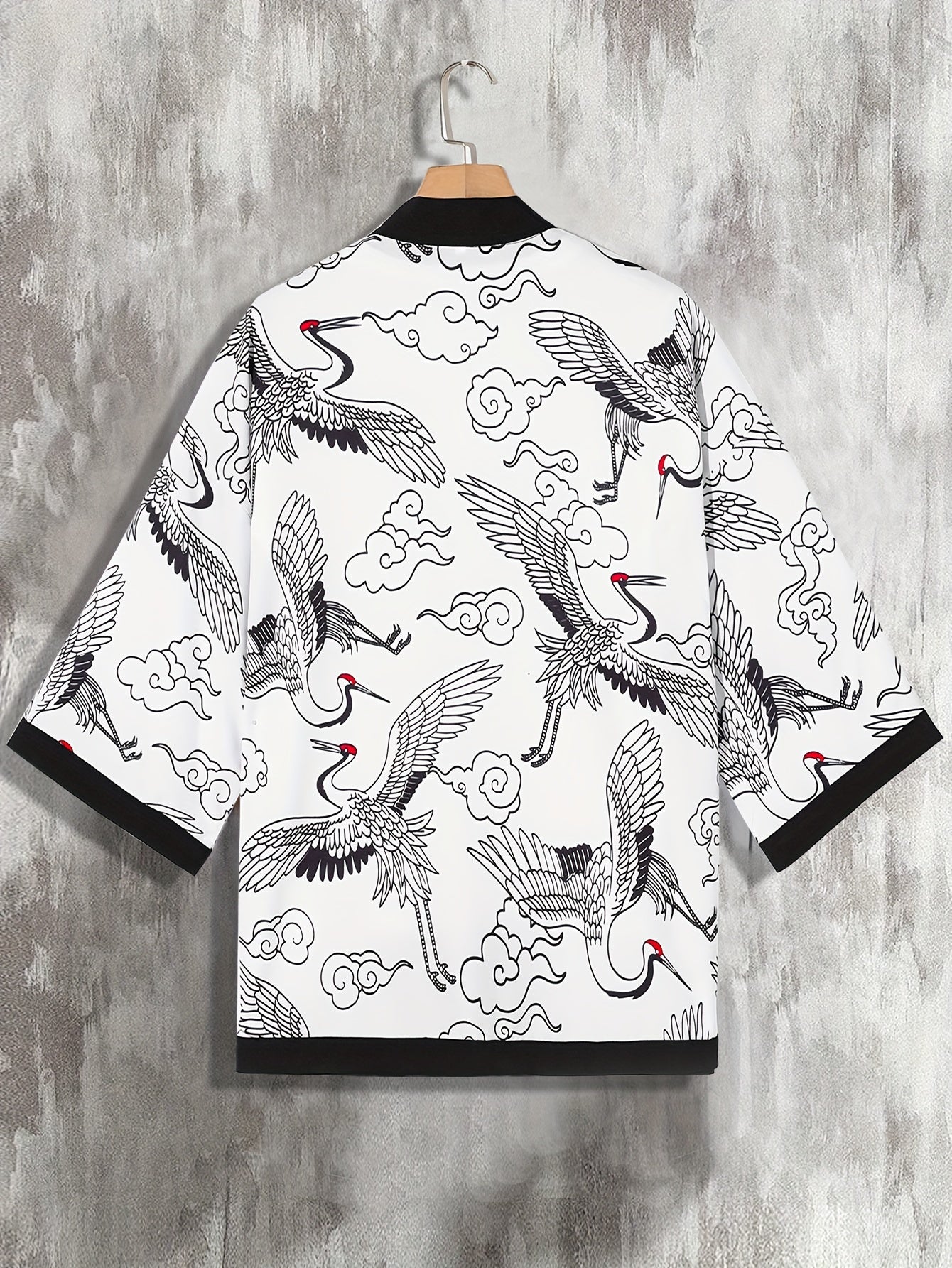 Men's loose-fitting kimono-style shirt with paisley and Japanese letter print, perfect for summer vacation photos at the resort.