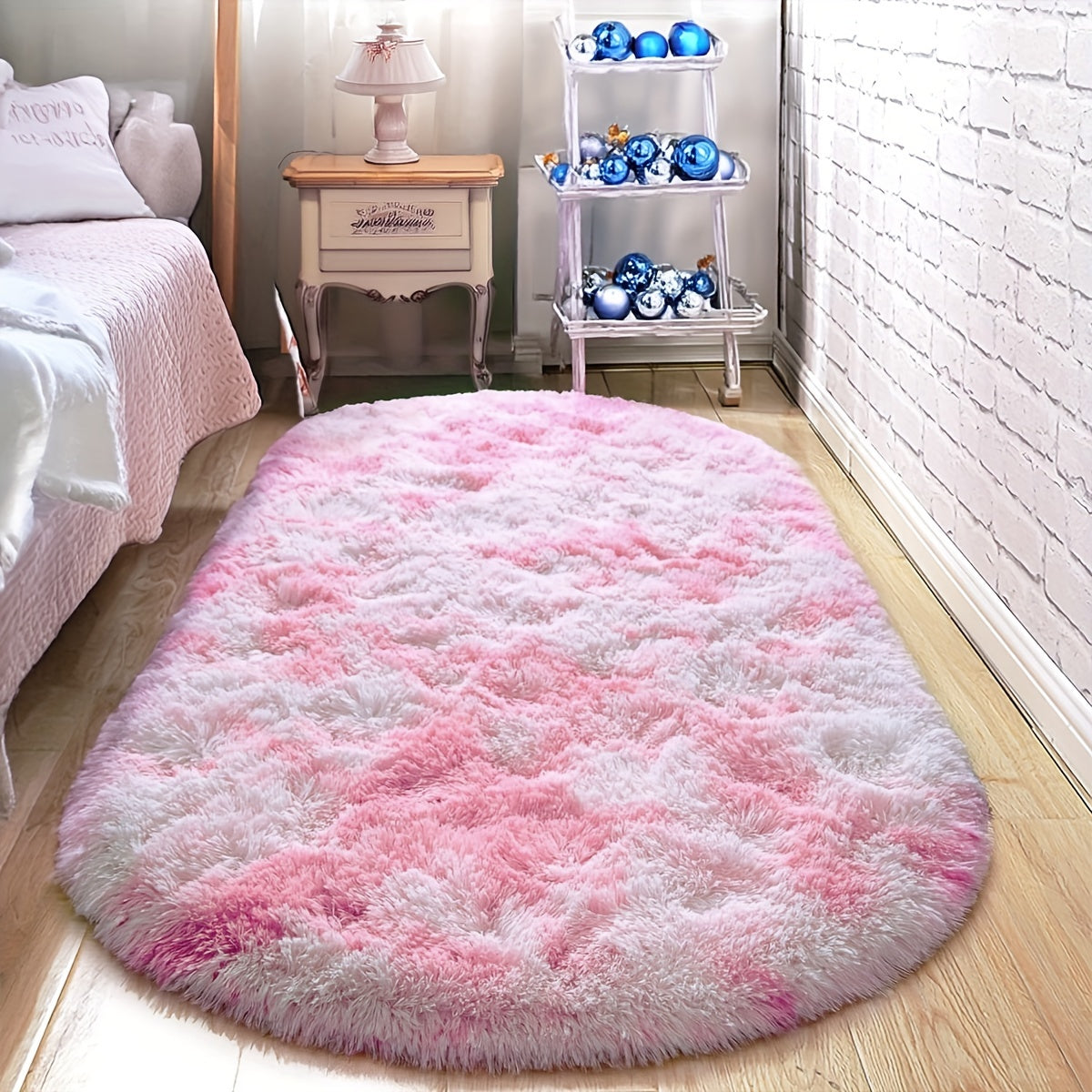 Soft and fluffy oval shaggy area rug, perfect for bedroom or living room. Made with skin-friendly thickened sponge and tufted polyester material. Durable and easy to maintain. Adds decorative touch to indoor spaces such as sofa, bedside, playroom, or