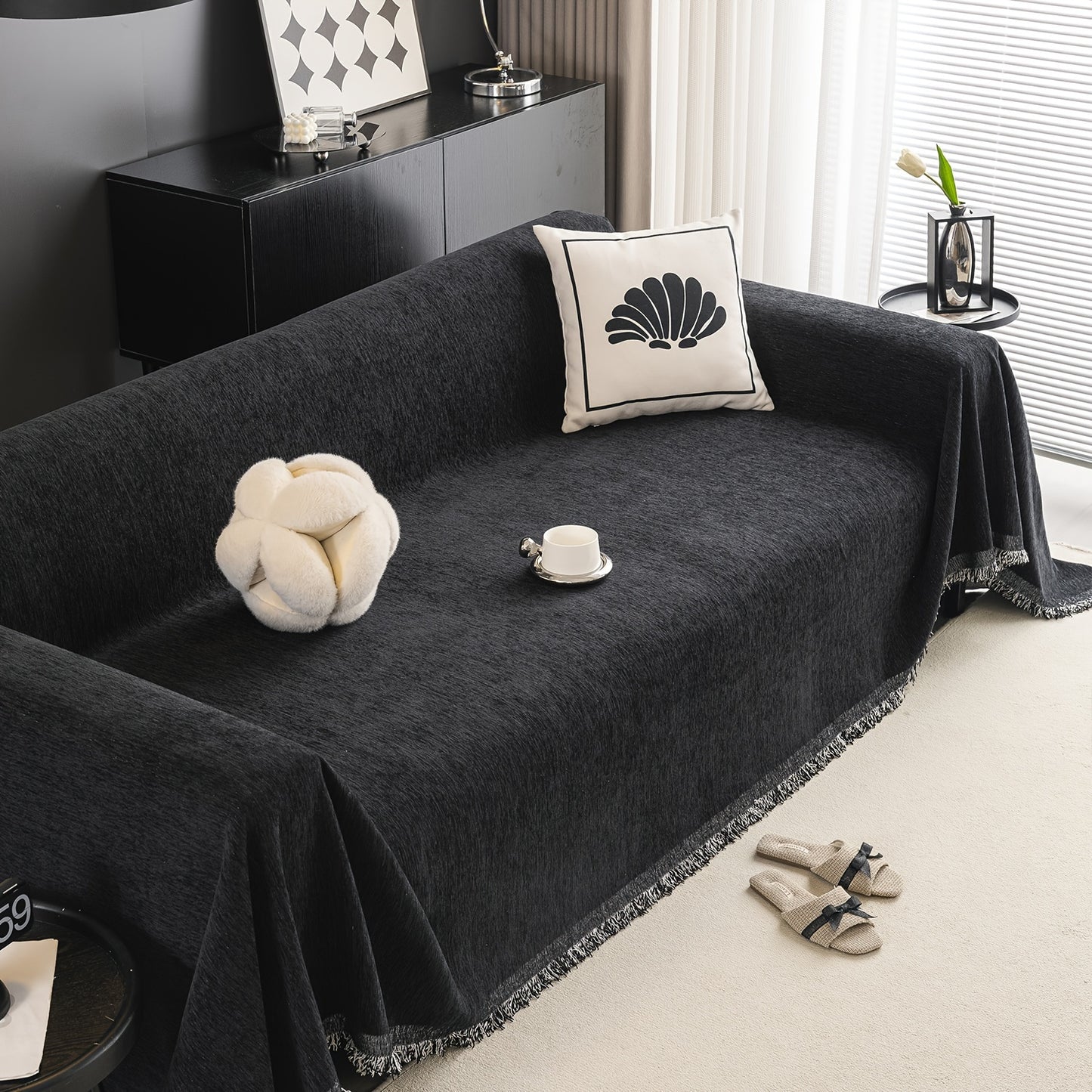 Waterproof sofa cover with tassels, washable and durable for universal furniture protection in living room home decor.