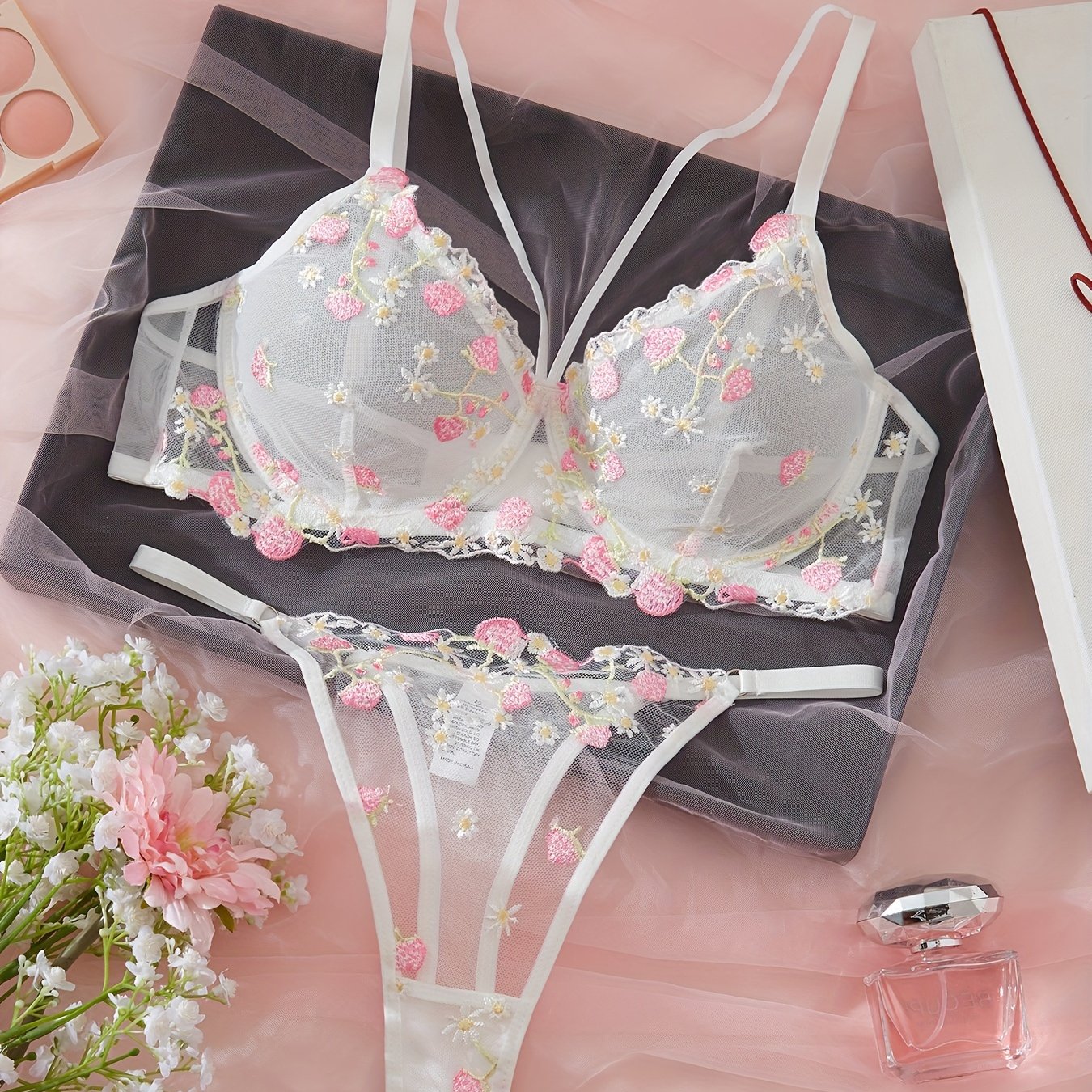 Floral embroidered chest straps cami bra and thongs lingerie set for women.