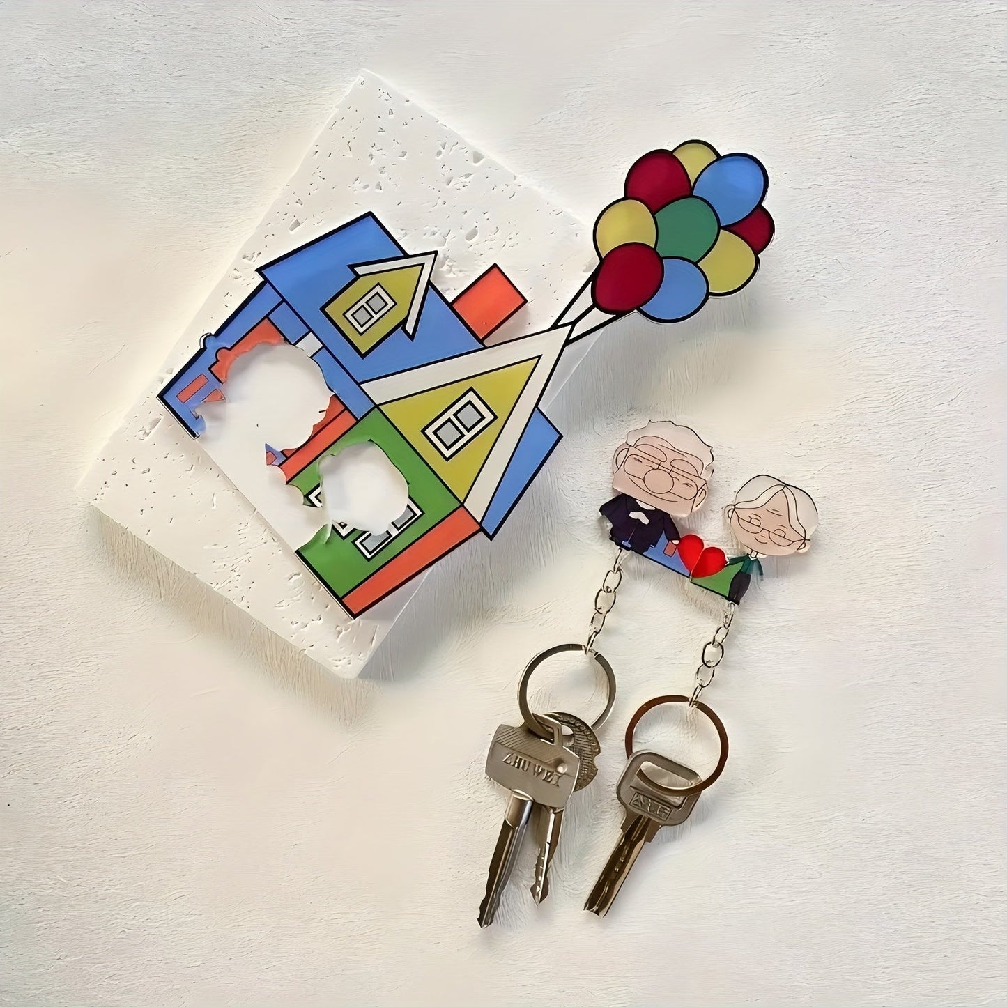 A romantic couple keychain set featuring acrylic keyrings with a self-adhesive back and heart pendant. This perfect gift for newlyweds and lovers is a Christmas novelty accessory for women, themed around friendship and love. The keychains are rectangular