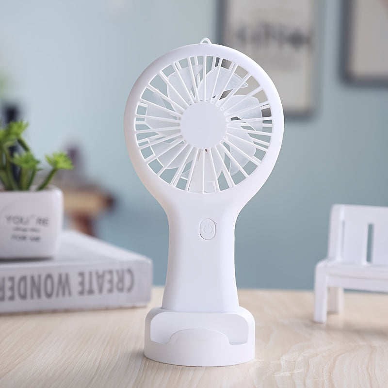 Compact and wearable mini fan for travel, office, outdoor, and home use. This handheld fan is portable, USB rechargeable, and includes a 400mAh lithium battery.