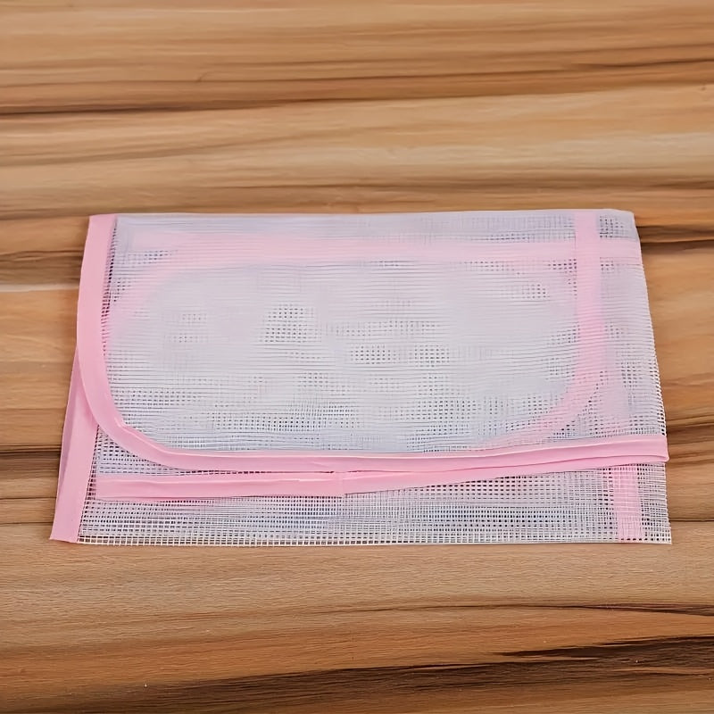 Protect your clothes and ironing board with the durable 2-Pack HeatGuard Ironing Protector Mats. These plastic steam ironing pads feature a mesh design for optimal heat distribution.