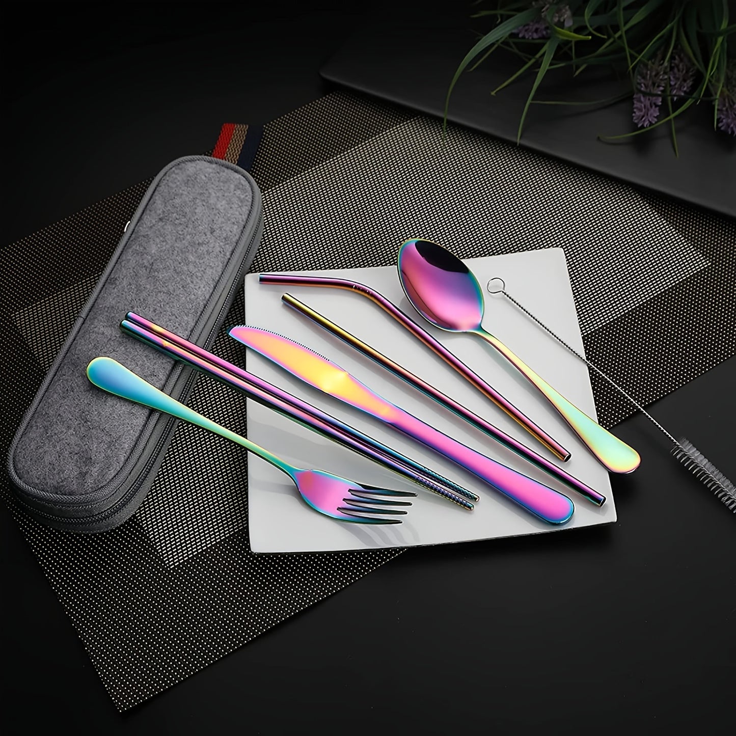 Travel camping set with 8 pieces of stainless steel cutlery includes knife, fork, spoon, chopsticks, cleaning brush, straw, and carry case.