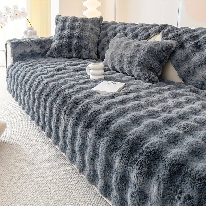 Faux rabbit fur sofa cover for cozy winter warmth. Pet-friendly, machine washable. Fits single to four-seater sofas. Perfect for living room, bedroom, office decor.