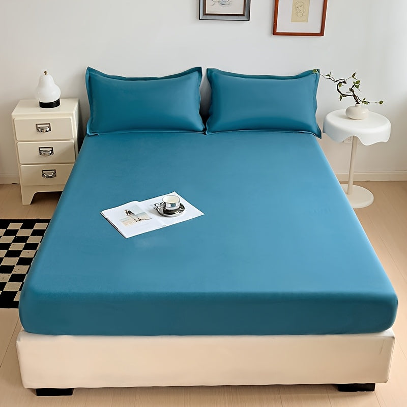 Soft and breathable microfiber fitted sheet in deep blue, stain-resistant, machine washable, all-season comfort bedding with solid color design and woven texture.