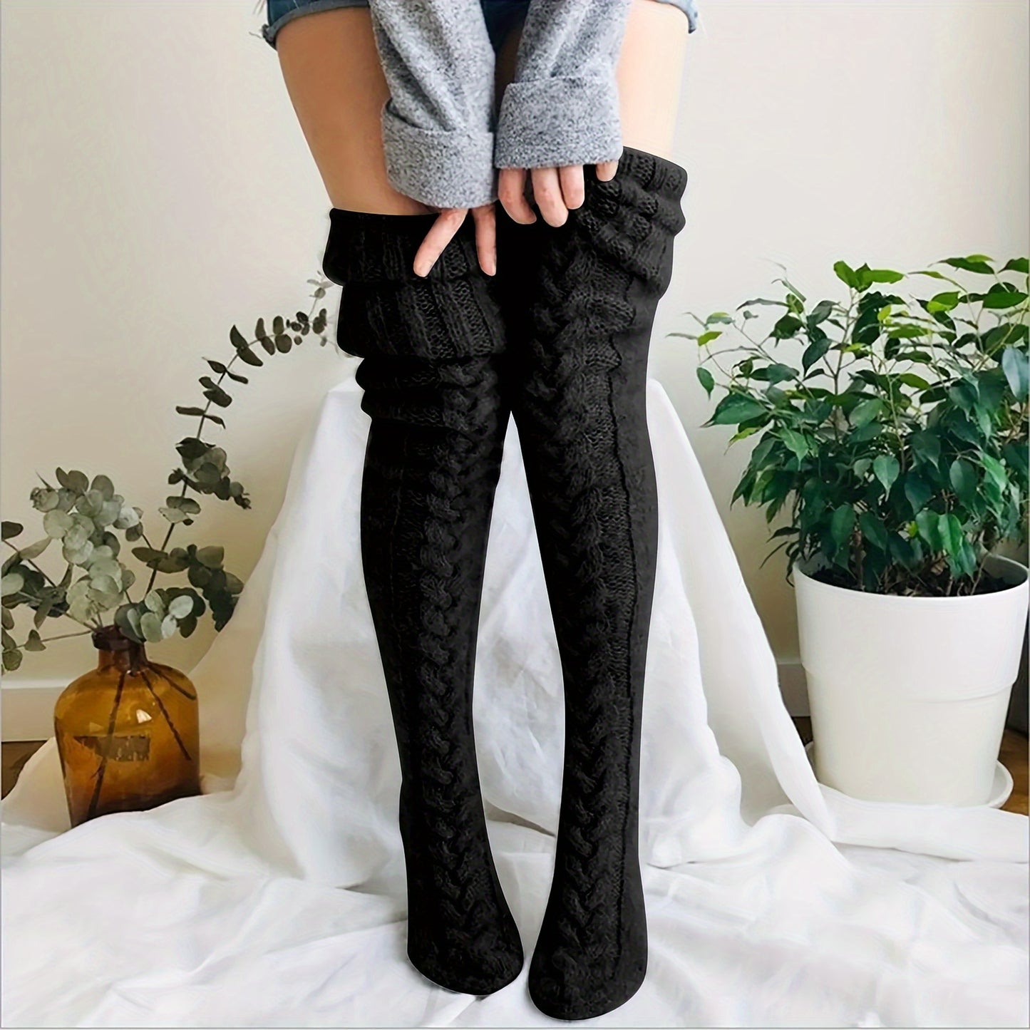 Warm thigh-high knitted socks for women.