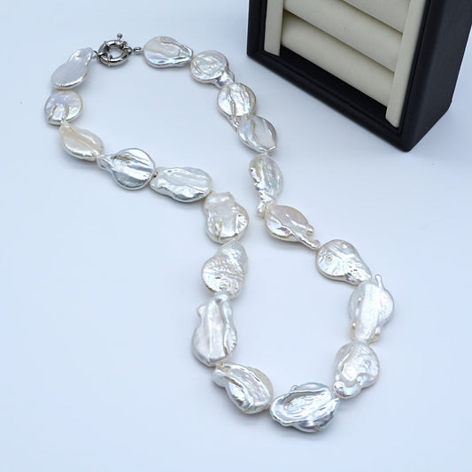 Unique and Elegant Women's Baroque Pearl Necklace - Perfect for Parties and Gifting. Made with Natural White Freshwater Pearls, each Irregular Teardrop-Shaped Pearl is One-of-a-Kind with Slight Variations in Shape and Color, adding to its Beauty and