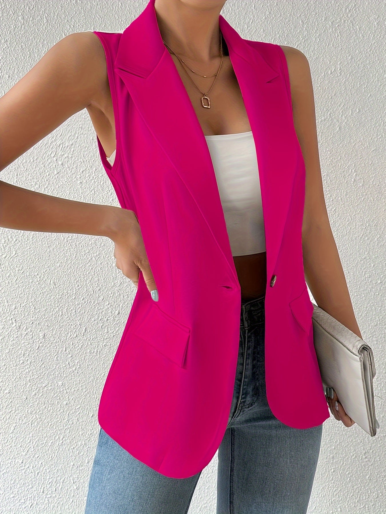 Sleeveless button front lapel vest in a solid color, suitable for spring and fall. Ideal for women's clothing.