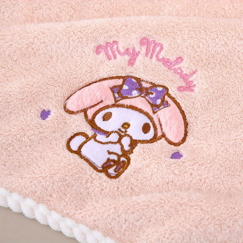 Contemporary cartoon-themed Hello Kitty and Friends plush bath towels in knit fabric made from a 40% cotton, 60% acrylic blend. Featuring a checkered pattern, low lint, 280gsm, and oblong shape, ideal for wash cloths.