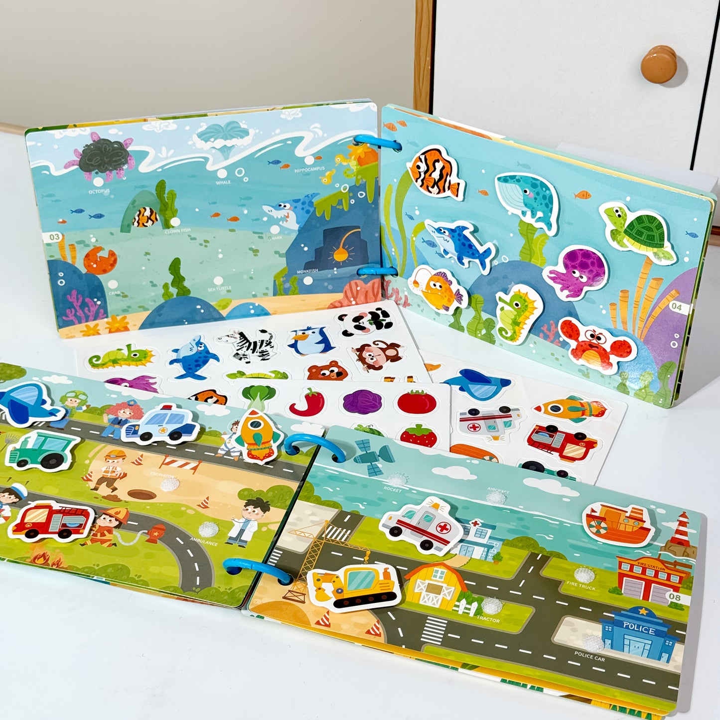 Reusable sticker book with quiet activities focusing on dinosaurs, fruits, animals, oceans, and transportation to improve cognitive, logical, and sensory skills through hands-on DIY tasks.