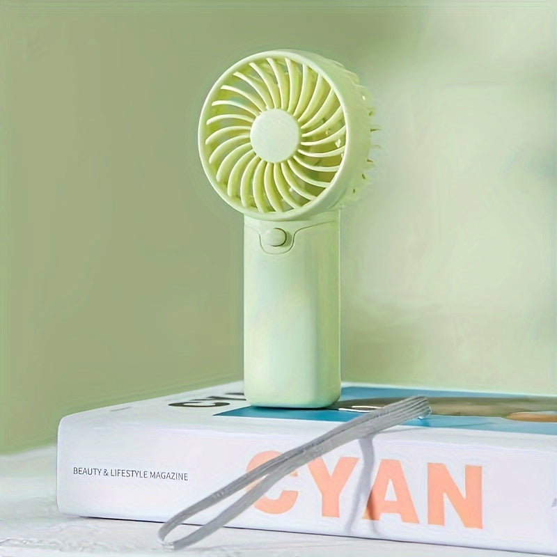 Portable Mini Fan - Lightweight and Battery-Powered Handheld Fan for Outdoor and Travel Use; AAA Batteries Sold Separately