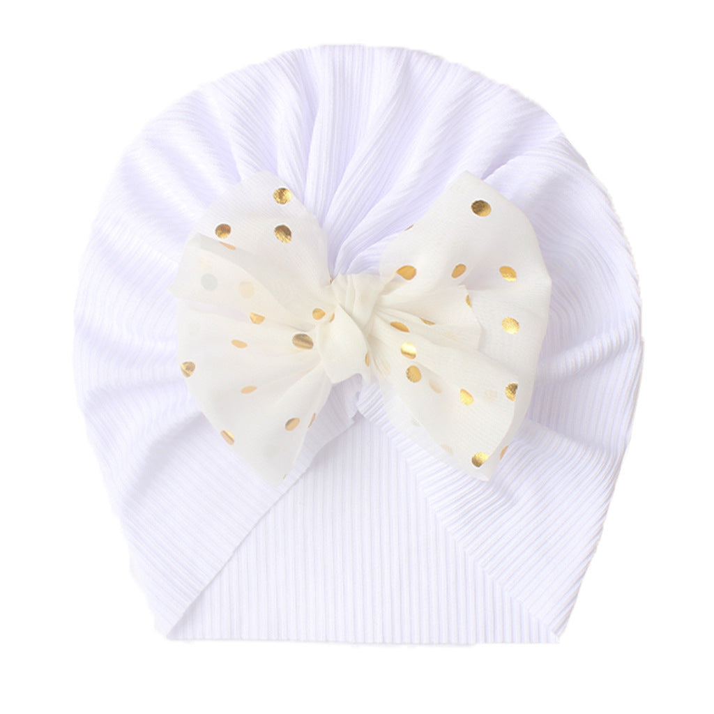 Polka dot printed bow head wrap for newborn infants and toddlers.