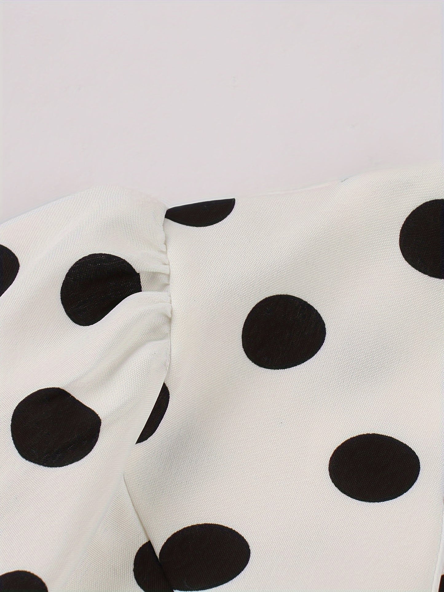 Polka dot print square neck dress with short sleeves and belt, perfect for spring and summer.