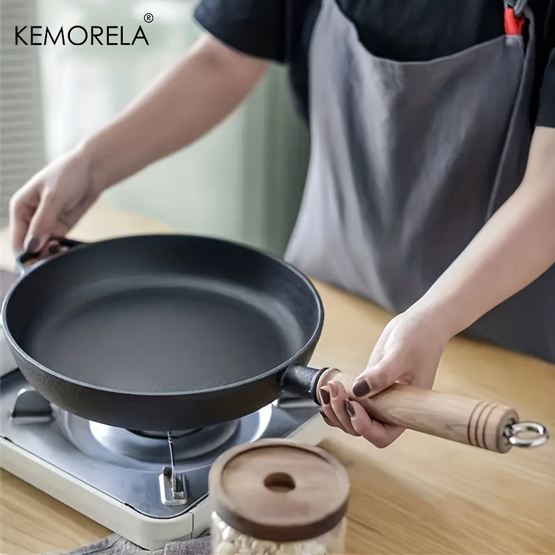 Experience the quality of the KEMORELA Premium Cast Iron Skillet. This uncoated, non-stick cookware is versatile and suitable for gas, electric, and induction stoves. Perfect for cooking steak, omelets, and more, this skillet features wooden anti-scald