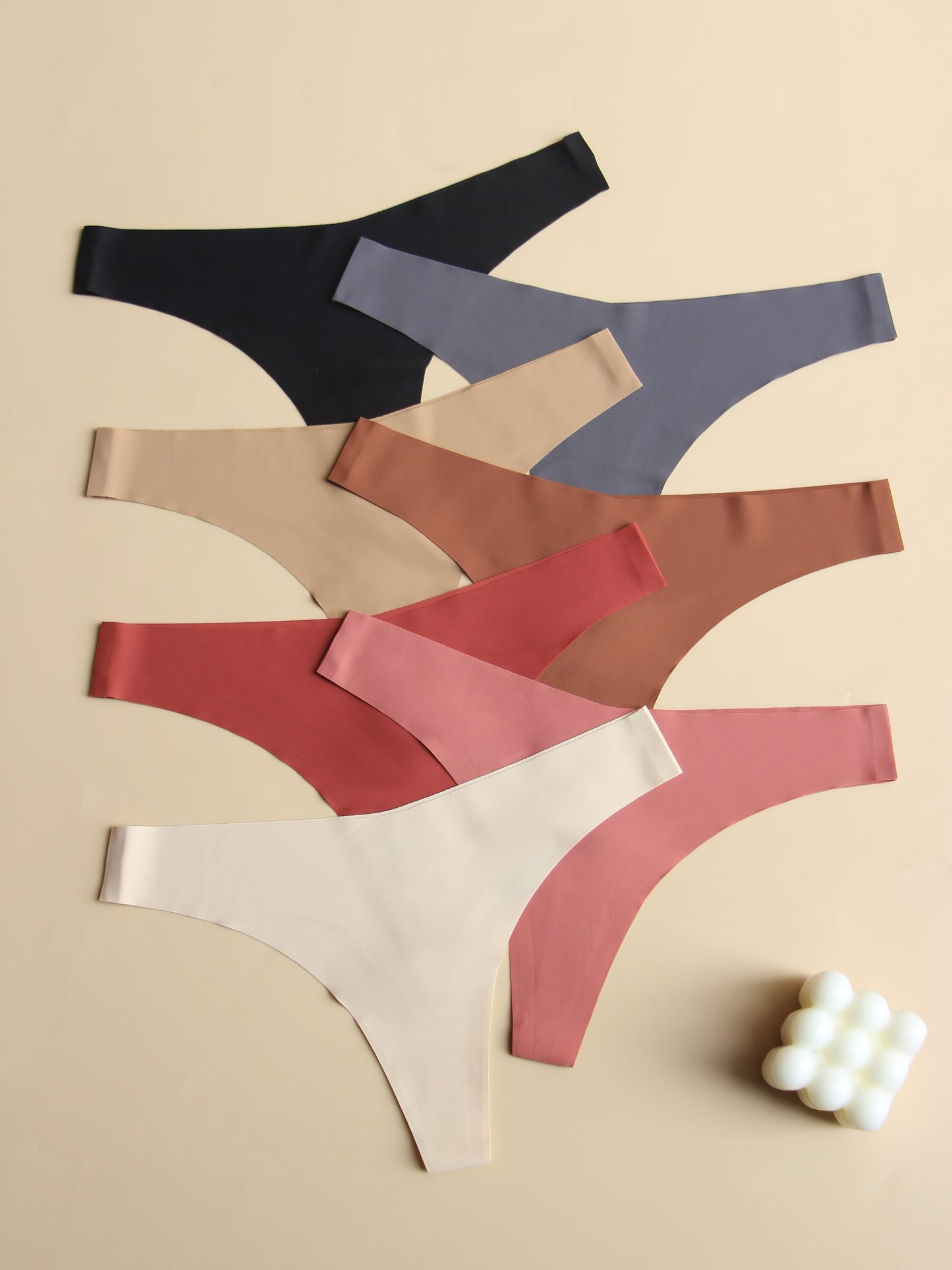 Innovative, comfortable 7-piece plain v-style women's underwear set with breathable, soft fabric and no visible marks.