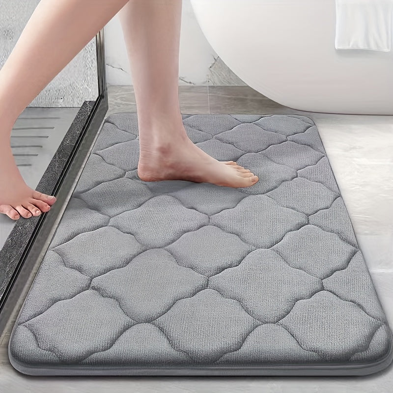 Soft plush bathroom mat with non-slip, absorbent, and machine washable features. Made of cozy coral fleece with a cute short pile design for a comfortable toilet experience.