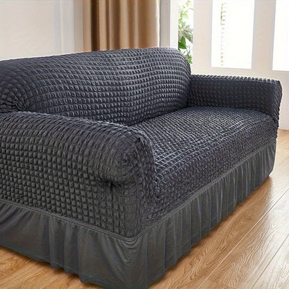 Seersucker skirt sofa cover protects couch from cat scratches in bedroom, office, or living room.