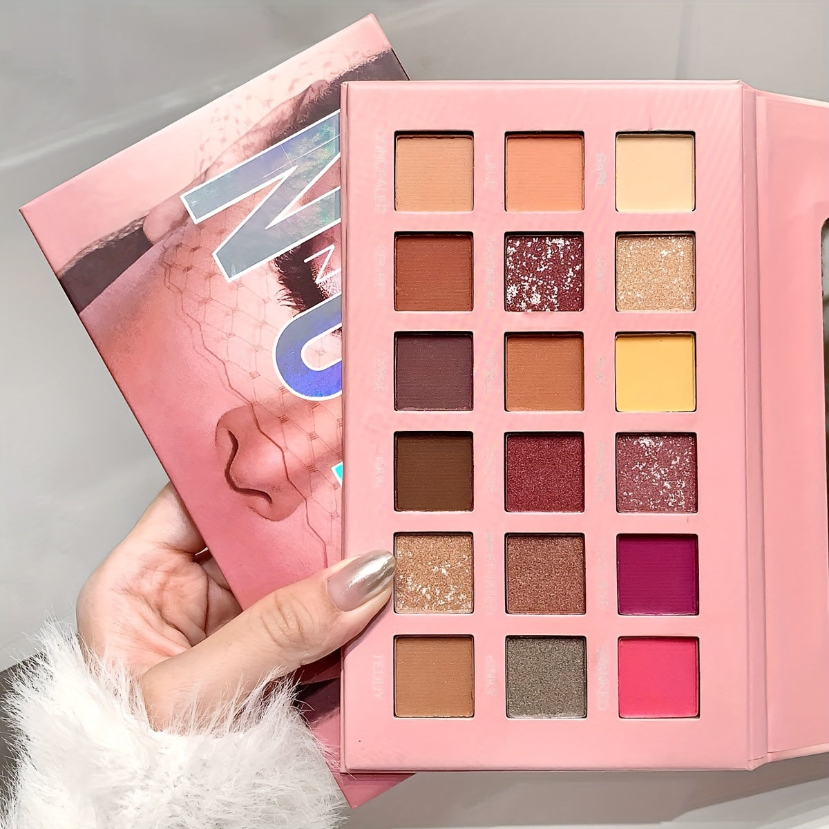 18-Color Desert Rose Eyeshadow Palette with various finishes for festivals, parties, and music events.