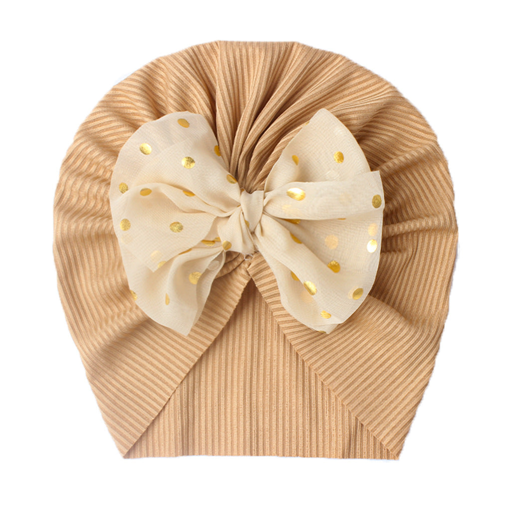 Polka dot printed bow head wrap for newborn infants and toddlers.