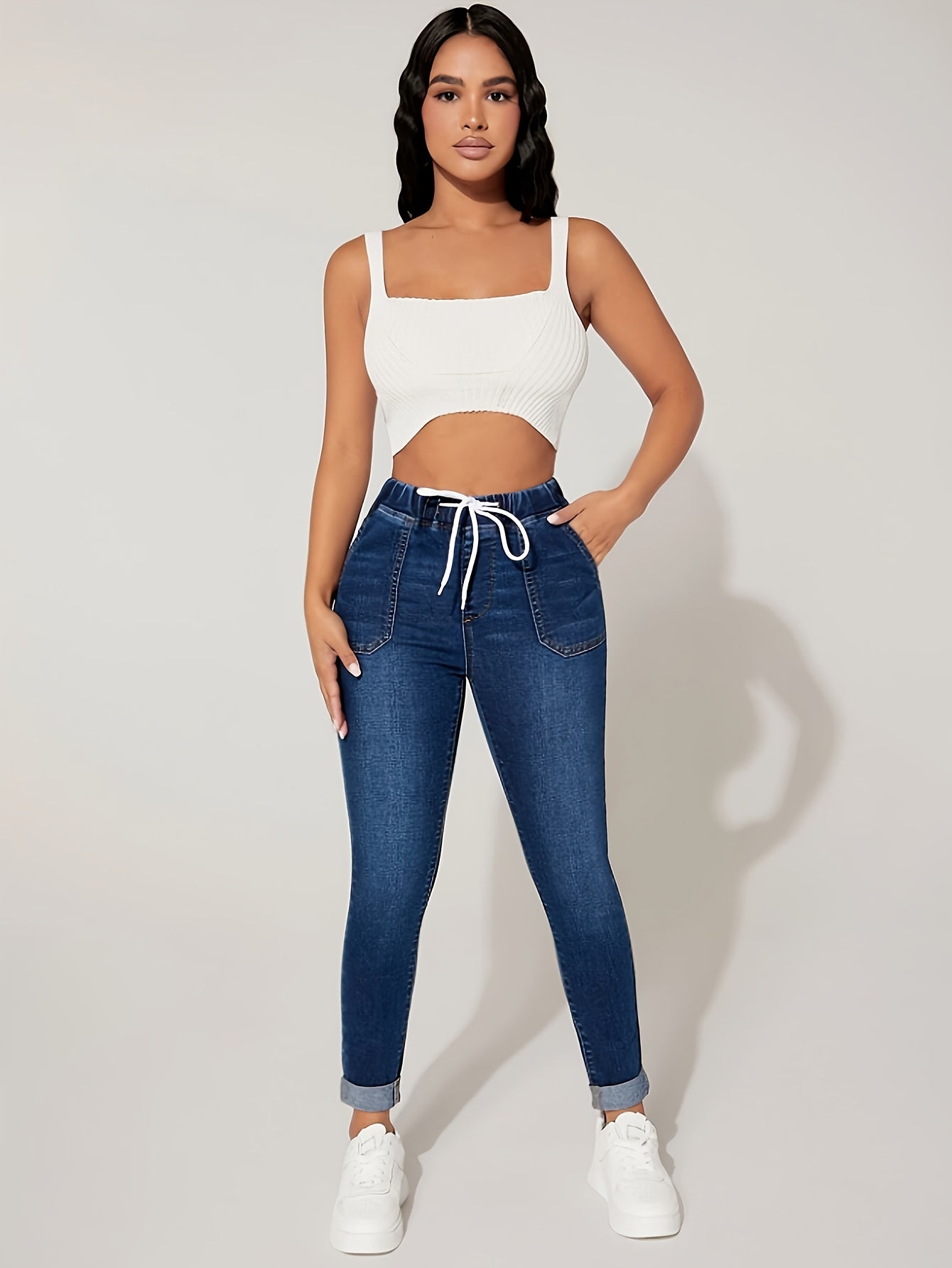 Plus size denim jeans for women with elastic drawstring waist and comfortable stretch fit.