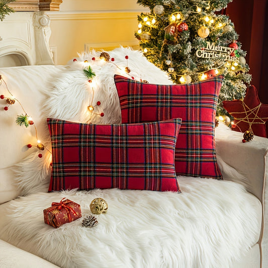 Machine washable 100% polyester throw pillow cover with a traditional reversible Christmas plaid design. Features a festive red geometric pattern and zippered closure for easy removal. Perfect for adding a touch of holiday cheer to your living room.