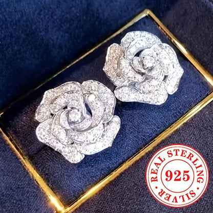 These stunning stud earrings are crafted from 4.4g of 925 sterling silver and feature synthetic zirconia stones. The elegant rose flower design exudes luxury and sophistication, making them a perfect accessory for daily wear or special occasions like