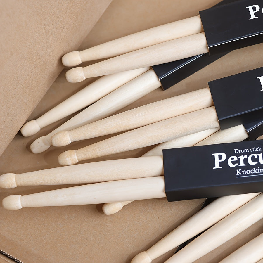 Premium maple drumsticks in 5A and 7A sizes with black logo, suitable for electric drums and practice.