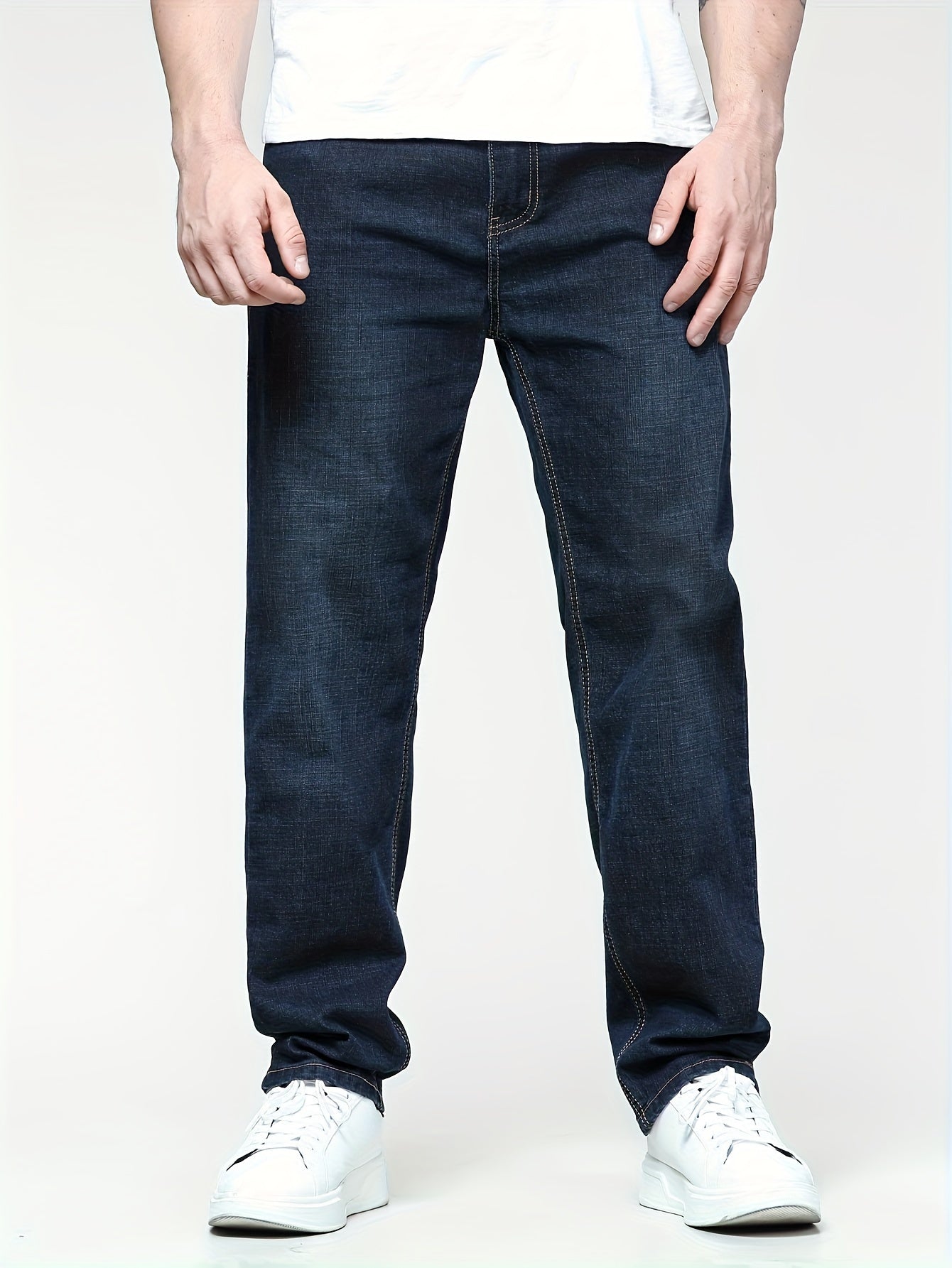 Men's solid denim pants for spring and fall in plus sizes.