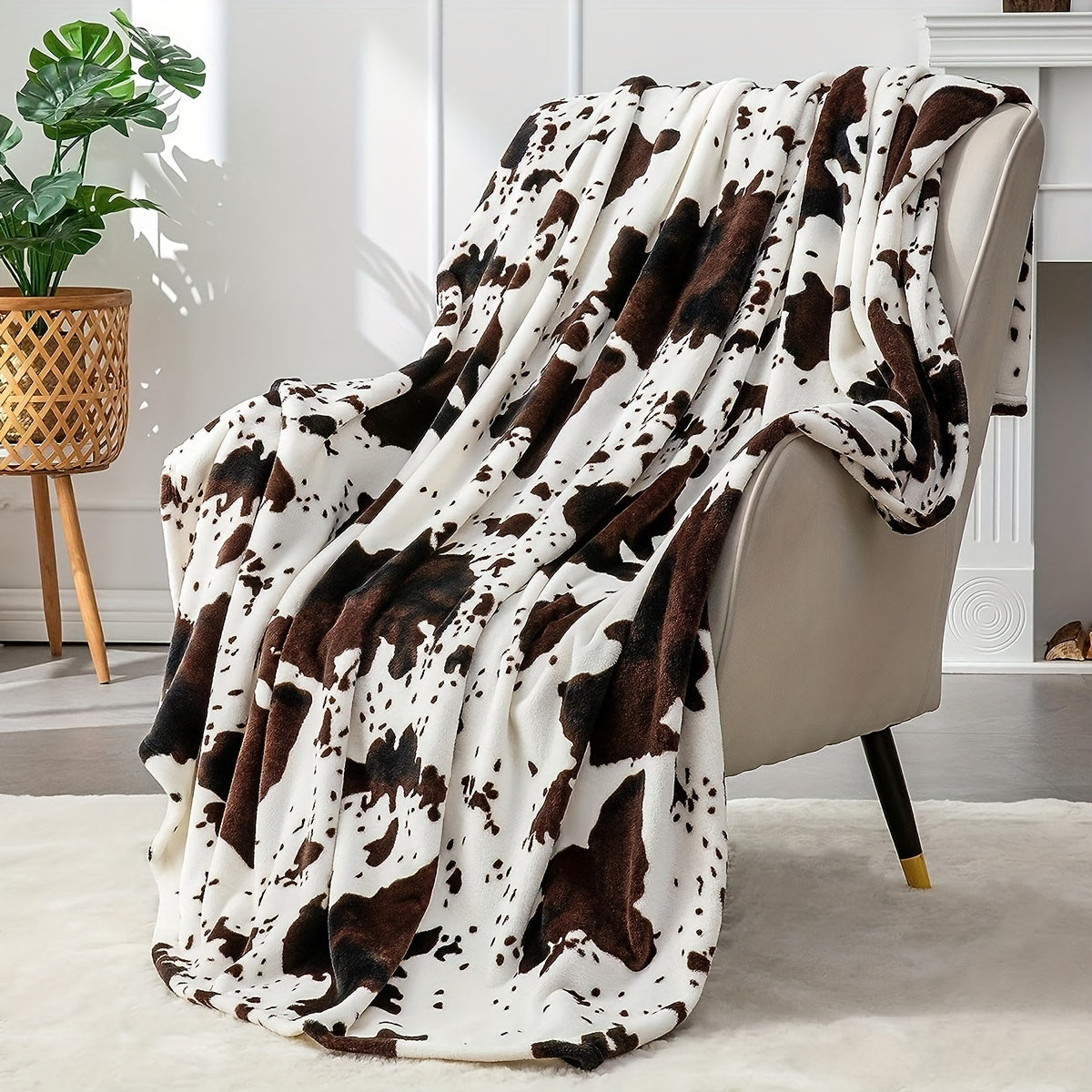 Get cozy with this soft and warm cow print blanket. Perfect for adding a touch of whimsy to your sofa, couch, or bed, this lightweight throw is made from plush flannel fleece. It's a great gift idea for any cow lover and perfect for all seasons.