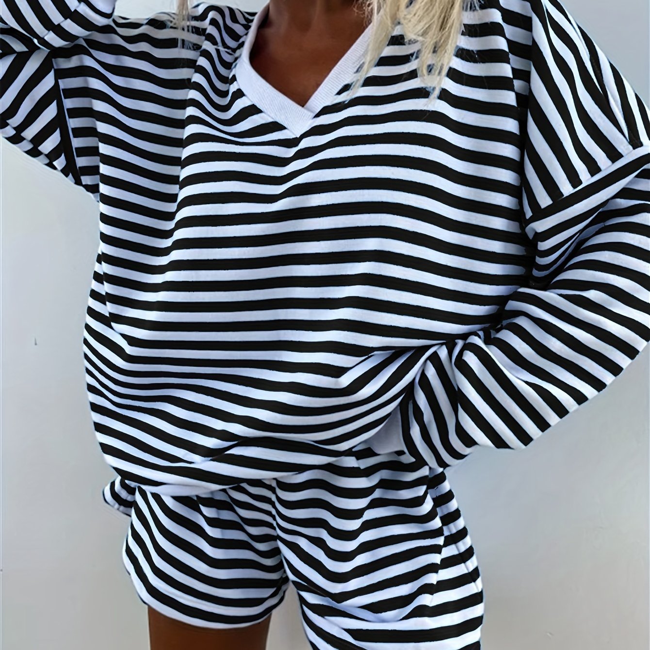 Striped lounge set for women, loose fit with long sleeve top and shorts, perfect for comfy fall wear.