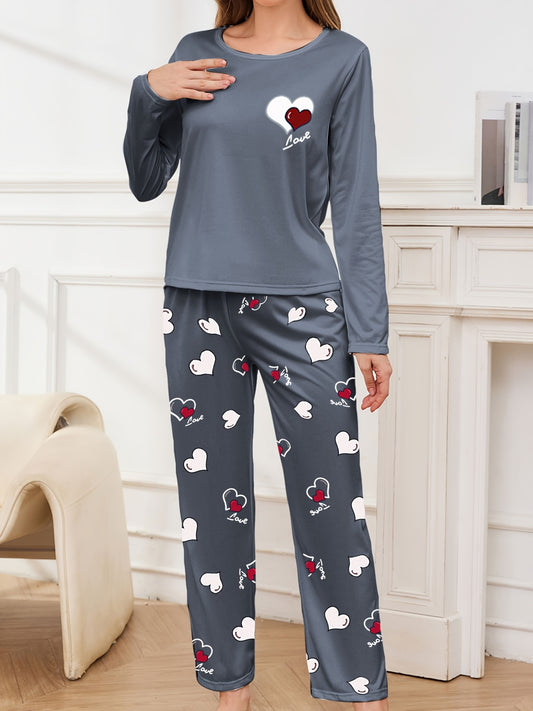 Women's pajama set for sleepwear and loungewear, featuring heart print, long sleeves, round neck top, and long pants for autumn and winter.