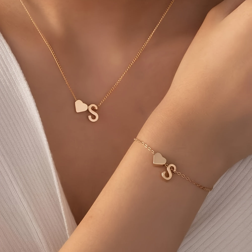 Chic two-piece set with metal heart and letter necklace and bracelet, ideal for daily wear.