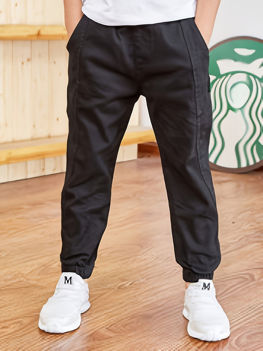 Boys' casual cotton joggers for outdoor play, solid color, comfortable fit, non-stretch fabric, regular length, breathable, easy-care, with elastic waistband. From spring/summer collection.