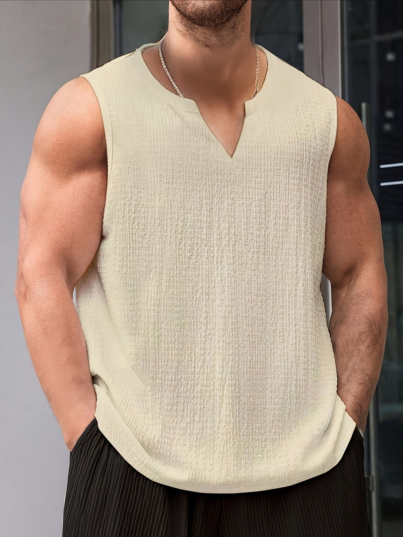 Polyester tank top for men with loose fit and slight stretch, perfect for casual summer outings.