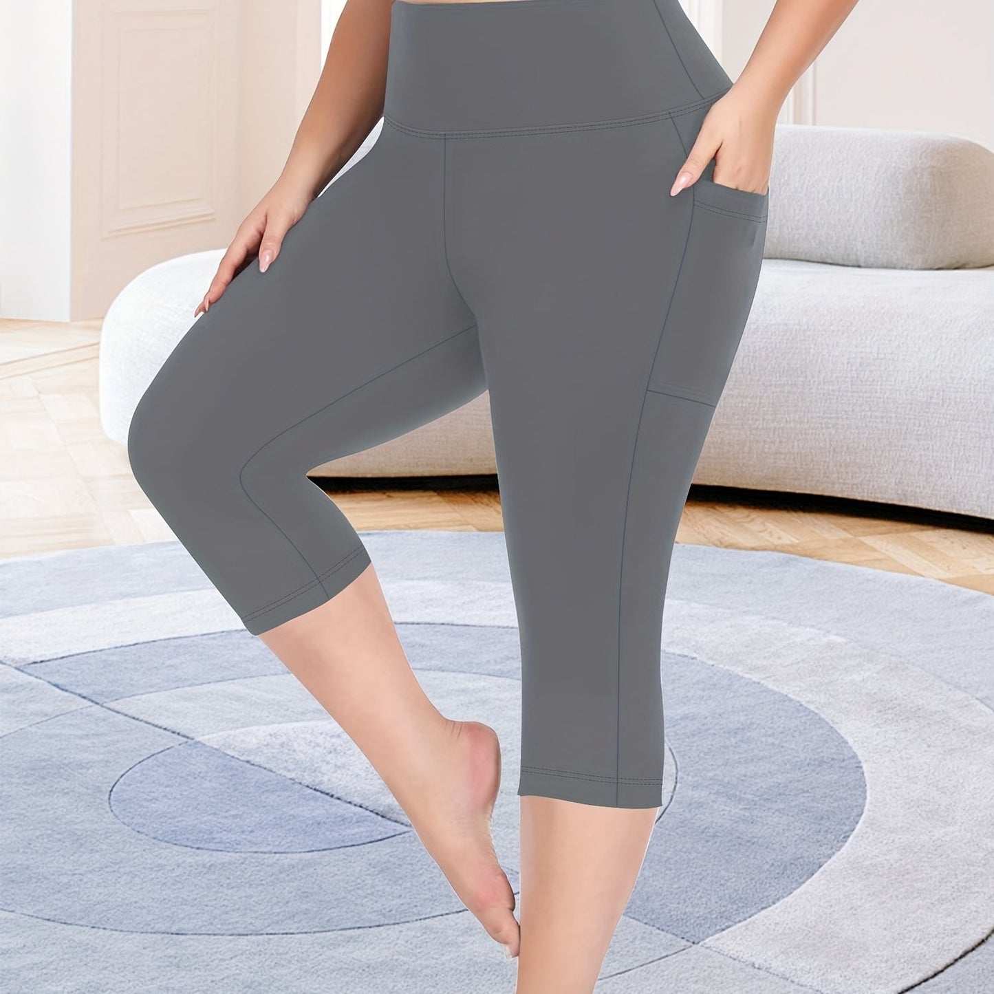 High-waisted capri leggings for plus-size women with side phone pockets, ideal for workouts.