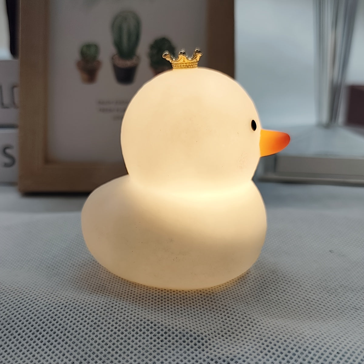 Duck-shaped LED night light, cute and fashionable, battery-powered with glossy finish. Perfect for bedroom decor and gift-giving for holidays, birthdays, or Christmas.