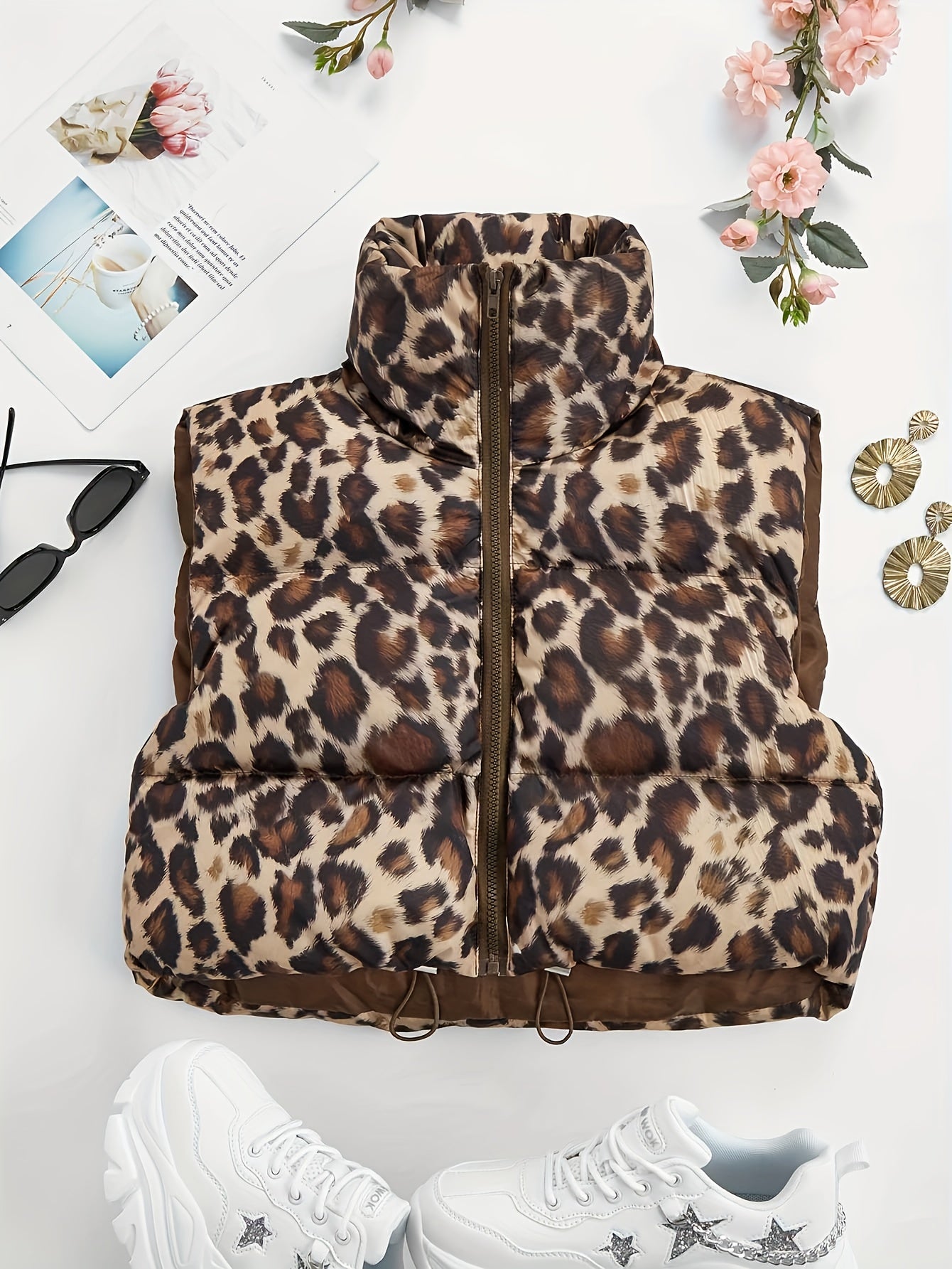 Women's leopard print padded coat with high neck drawstring, made of 100% polyester woven fabric for fall/winter outerwear.