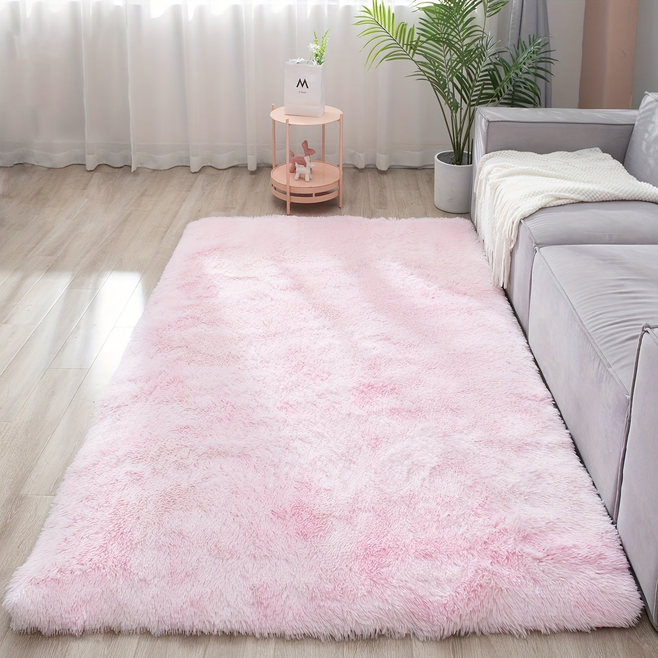 Soft and fluffy rectangle area rug perfect for your bedroom. This plush carpet is thick and non-slip, making it ideal for your living room. Made with machine-made polyester fiber, this low-pile rug is washable for easy cleaning. Perfect for indoor use.