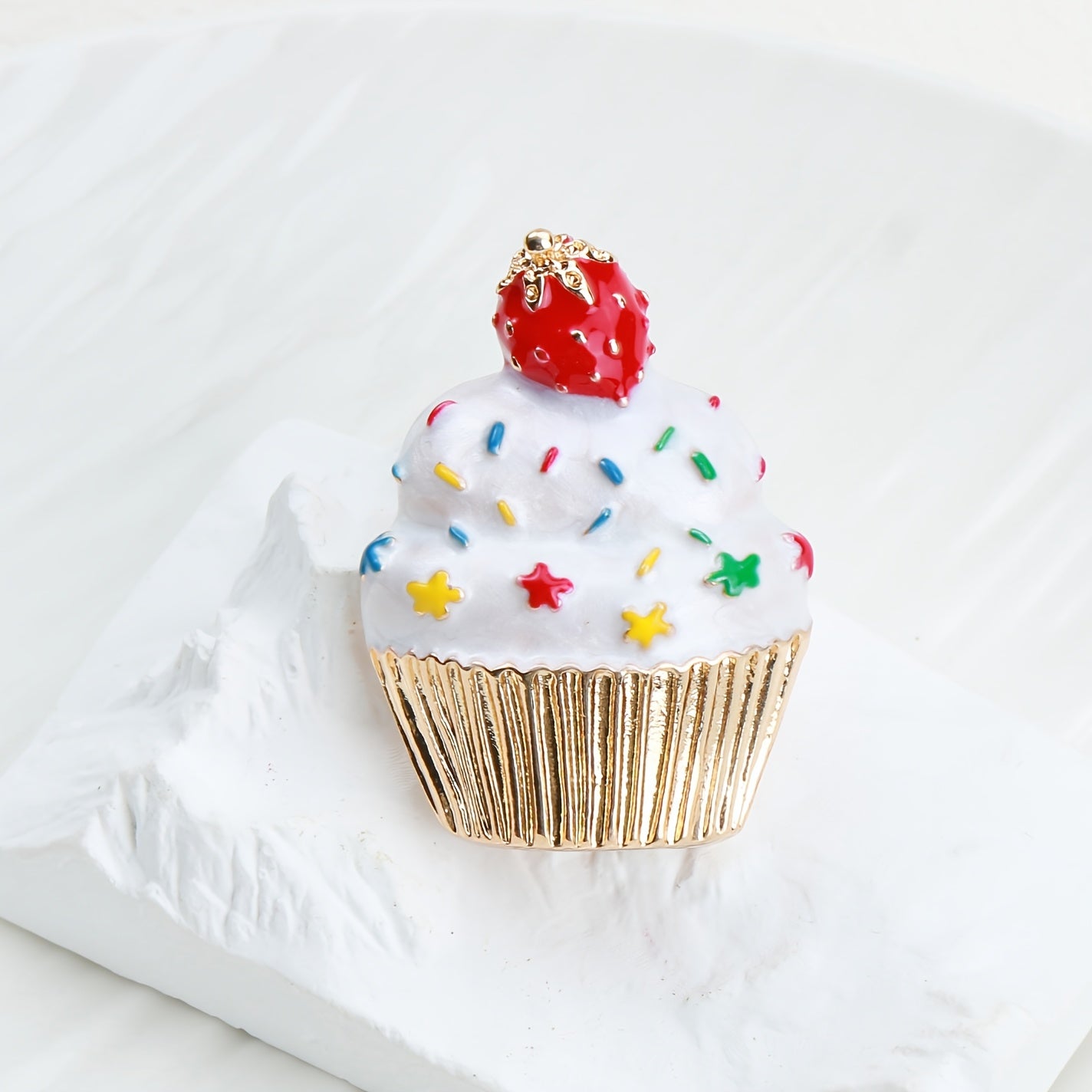 Add some festive flair to your holiday outfits with this adorable Cute Christmas Cupcake Brooch Pin. Crafted from enamel, this accessory is the perfect way to spread holiday cheer wherever you go.